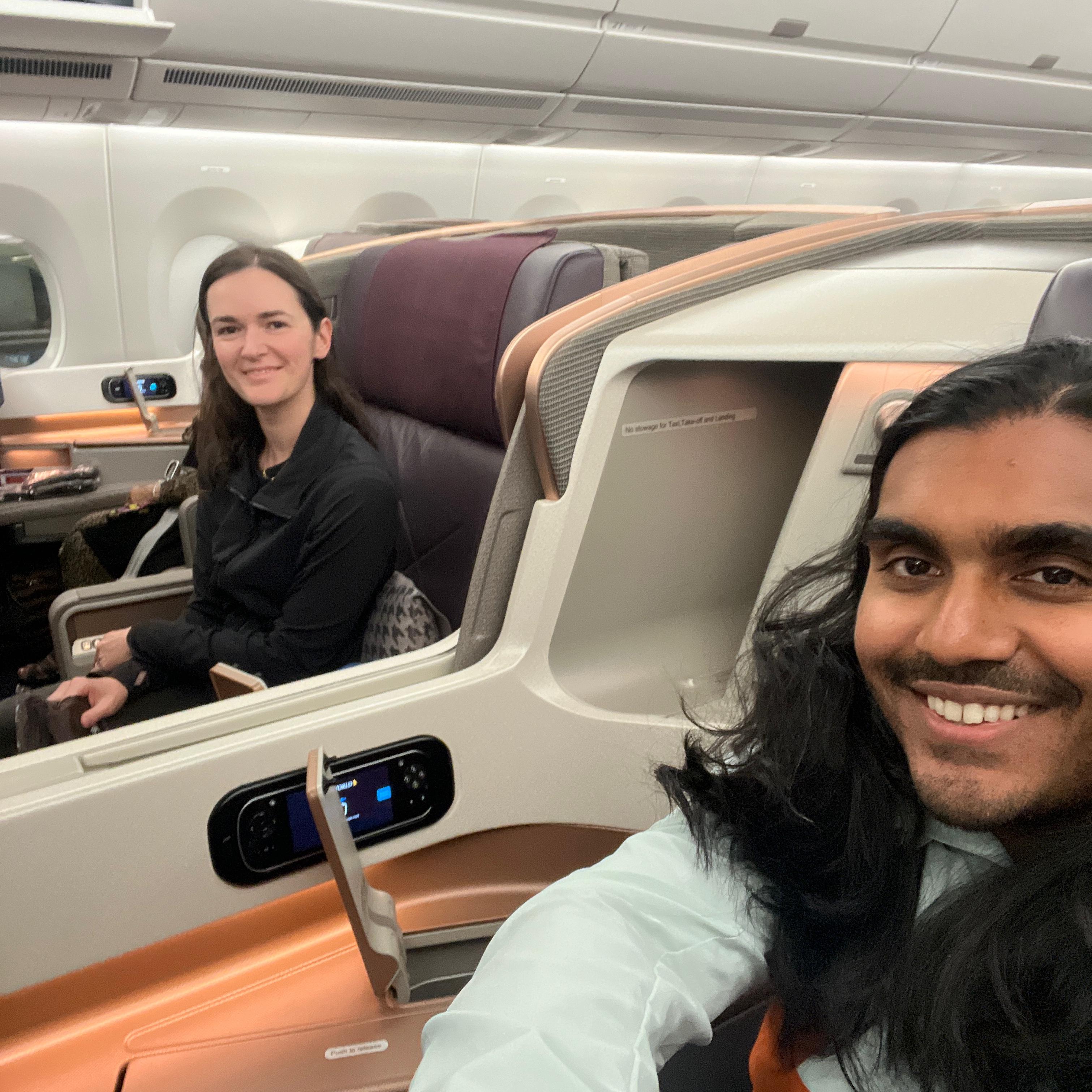 Adarsh and Kirsten on their flight to Singapore